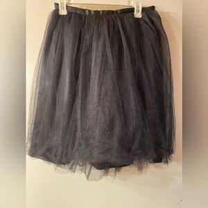 Tutu Moi 100% tulle with satin lined skirt.  Side zipper. Black